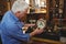 Horologist checking a clock in workshop