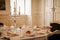 Horovice castle interior, Baroque chateau, Dining room with carved white furniture, silver crockery and service, crystal