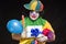Horrible clown and hat on head with presents and candies in hand