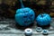 Horribly blue Halloween, painted blue pumpkins and candles