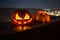 Horror Halloween concept. Close up view of scary dead Halloween pumpkin glowing at dark background.