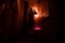 Horror silhouette of person in window. Scary halloween concept Blurred silhouette of witch in bathroom. Decorated with fireworks