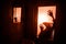 Horror silhouette of woman in window. Scary halloween concept Blurred silhouette of witch in bathroom. Selective focus