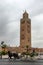 A horse and buggy ride past the tower of Koutoubia Mosque in Marrakesh, Morocco.