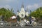 Horse Carriage and tourists in front of Andrew Jackson Statue & St. Louis Cathedral, Jackson Square in New Orleans, Louisiana