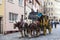 The horse carriage with tourists rides along the streets in Nuremberg, Bavaria