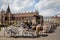 Horse carriages at the main square Rynek Glowny in Krakow old town