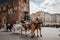 Horse carriages at the main square Rynek Glowny in Krakow old town