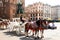 Horse carriages at the main square Rynek Glowny in Krakow old town