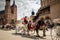 Horse carriages at the main square Rynek Glowny in Krakow old town