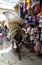 A horse carrying a load of merchandise in the Fez medina, Morocco.