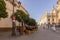 a horse cart riding through the Sevilla architecture, Spain