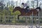 Horse cross country teenage competition jumping tree trunks and jumps over barrels of water and colored bars