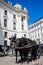 Horse-drawn carriages in front of the Hofburg Imperial Palace