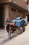 Horse drawn cart full of blue gasbags