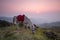 Horse eating grass on Pha tang hill with beautiful twilight sky