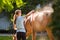 Horse enjoying the shower