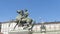 Horse Equestrial statue with Palazzo Reale in background. Statue in the Royal Palace entrance, 1844 Castor, Turin, Italy