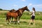 Horse and foal with girl