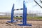 Horse obstacle course outdoors summertime. Poles in the sand at equestrian center outdoors