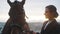 Horse Owner With Her Seal Brown Horse Holding Its Lead Rope Smiling At Her Horse