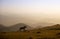 horse pacing peacefully in the mountains at sunset