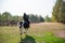 Horse ride of a young girl in places with beautiful autumn countryside landscapes