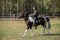 Horse ride of a young girl in places with beautiful autumn countryside landscapes