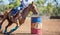 Horse And Rider Competing In Barrel Race At Outback Country Rodeo