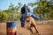 Horse And Rider Competing In Barrel Race At Outback Country Rodeo