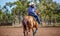 Horse And Rider Competing In Barrel Race At Outback Country Rodeo