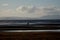 Horse Rider on a Deserted Beach at Dusk