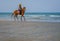 Horse and rider on Hua Hin beach.
