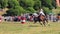 A horse with a rider jumps over a barrier at an equestrian championship, Grudziadz, Poland, June 18, 2023