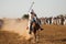 Horse rider, riding in a tent pegging event