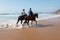 Horse riding at the beach at the ocean