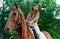 Horse riding experience. Horseback journey. Meadow encounter: woman, horse, nature. Equestrian benefits, lessons, emotional