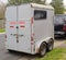 Horse trailer parked on neighborhood street