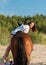 the horse and the woman on the beach are getting ready to go for a walk