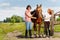 Horseback riders having rest with their bay horse