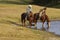 Horseback Riders at Water Hole