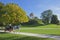 A horsedrawn carriage passing the Monopteros in the English Garden in Munich, Germany.