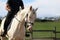 Horseman and a beautiful blue eyed dressage horse galloping