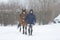 Horserider walking with horse