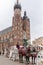 Horses carriages at Main square called Rynek Glowny in Krakow, Poland