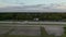 Horses with riders Harness racing on Race Track in Berlin, Germany at Sunset from Aerial Wide Angle Shot