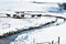 Horses in Snowy Pasture with Stream