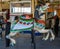 Horses on a traditional fairground B&B carousel at historic Coney Island Boardwalk in Brooklyn