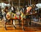 Horses on a traditional fairground carousel