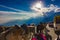 Horses walking on hilly road beside cars with blue skies and sunrise, manali tourism